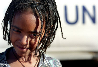 Famine. A girl waiting at a distribution site in Sirer village where American wheat from the United Nations WFP (World Food Programme) is being handed out. Many people have left their farms because of...