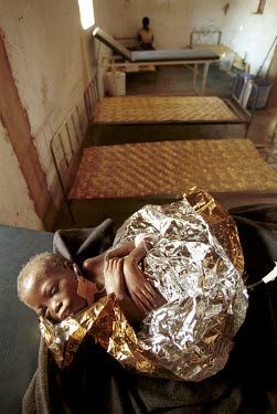 A child suffering from severe malnutrition in the intensive care unit at a Medecins Sans Frontieres (MSF) therapeutic feeding centre. The military strategies of the government armed forces and UNITA r...