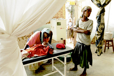 A mother mourns for her child who has died of malnutrition at a Medecins Sans Frontieres (MSF) therapeutic feeding centre. The military strategies of the government armed forces and UNITA rebels towar...