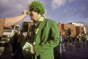 Celtic supporters congregate outside the stadium before a home match against Rangers.The 'Old Firm' rivalry between Celtic and Rangers is renowned as the world's most intense football derby.