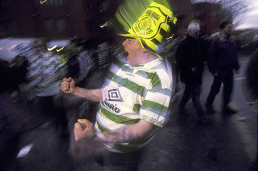 Celtic supporters celebrate outside the ground after a home victory against Rangers.The 'Old Firm' rivalry between Celtic and Rangers is renowned as the world's most intense football derby.