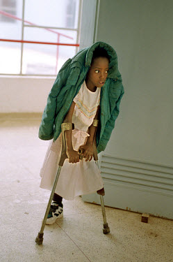 A child practices walking on crutches at the International Red Cross hospital. Hundreds of thousands of Angolans have lost limbs after stepping on landmines and in some towns one-in-four people have l...