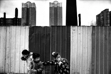 Children trying to shield their eyes from dust whipped up by the wind. Shenyang is one of the main heavy industry bases and most polluted cities in China. Today the factories are not profitable any mo...
