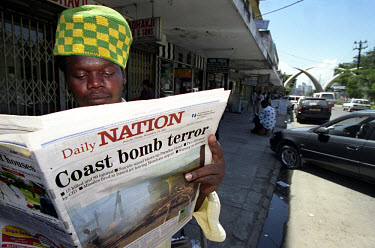 The day after the terrorist attacks in Mombasa, locals read newspaper reports in the town centre. 13 people were killed when a car bomb exploded outside the Israeli-owned Paradise Hotel, at the same t...