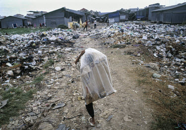 Street children collecting waste from a rubbish dump for recycling.