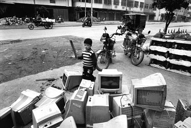 Computer waste lies everywhere in Guiyu. China has banned the import of electronic waste and ratified the Basel Convention. But occasional crackdowns have done little to halt the recycling, which thr...