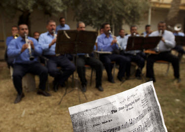The new Iraqi police academy's brass band plays 'Star Spangled Banner', reflecting their training by American police officers.