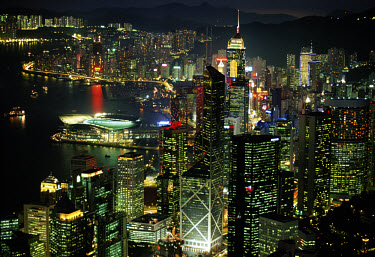 Lights and skyscrapers of Hong Kong seen from the Peak. Bank of China building in foreground, and the Convention Centre jutting out into Hong Kong harbour at left.