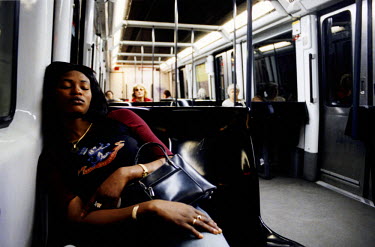 Joy. a Nigerian sex worker, travelling home on the underground after a long day's work. Thousands of Nigerian women are trafficked into Western Europe every year. They are forced to work in the sex in...