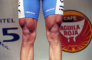 Unnaturally developed muscles on the legs of a stage winner in the Vuelta a Colombia. The 53rd Vuelta a Colombia took place against a backdrop of civil war and violence. The bicycle race is guarded al...