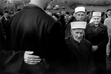 Muslim imams gather at a funeral.