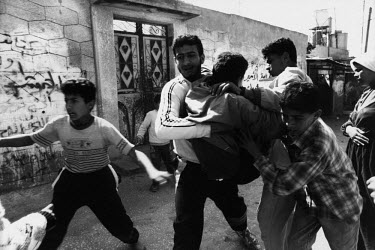 A gunshot victim is rushed to safety during clashes with Israeli soldiers in the Jabalya refugee camp.