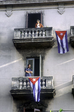 Residents hang Cuban flags from their balconies during a demonstration in Vedado.