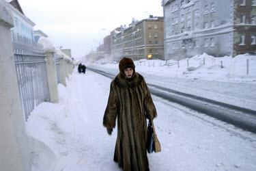 A woman dressed head to toe in fur to survive temperatures of minus 30 degrees celsius. Residents of this resource-rich city above the Arctic Circle in Siberia battle long polar nights in which the su...