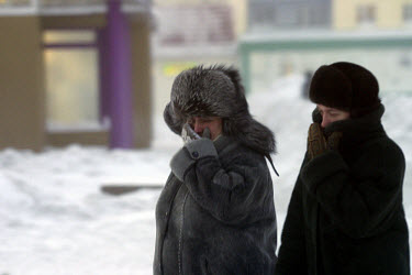 Women dressed in fur cover their faces in temperatures of minus 30 degrees celsius. Residents of this resource-rich city above the Arctic Circle in Siberia battle long polar nights in which the sun ba...