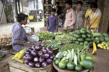 Market stall selling vegetables.