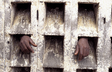 Hands of a detainee in Mbimba prison.