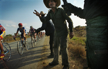 Campesinos cheering on cyclists in the Vuelta a Cuba (the Tour of Cuba cycling race).