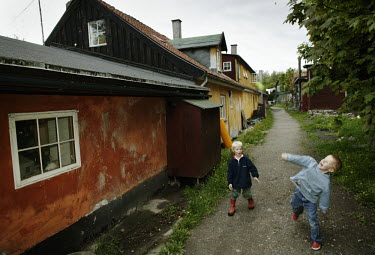 Children playing near old houses in the Christiania neighbourhood.