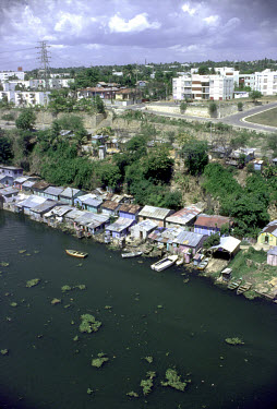 Riverside shacks and luxury housing.