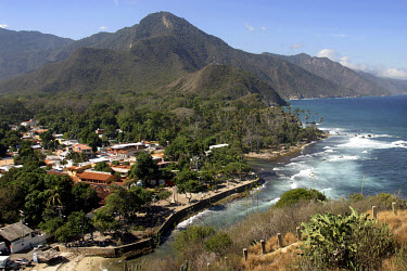 View from a hilltop over the coastal town of Choroni. The coastline's palm fringed beaches are popular with both domestic and foreign tourists.