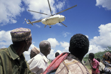 A helicopter delivering aid from the United Nations World Food Programme (UN WFP) to villagers affected by flooding along the Tana river.