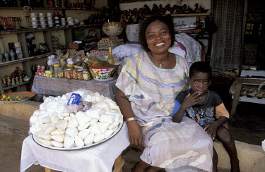 Irene D'Almeida and her son, in her shop which was opened with money from a credit union.