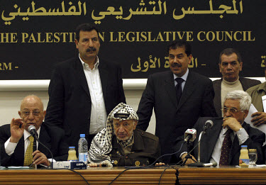 Palestinian President Yasser Arafat, the chairman of the Palestinian Legislative council Ahmed Qurei (aka Abu Ala) (left) and the Palestinian prime minister-designate Mahmoud Abbas (aka Abu Mazen) (ri...