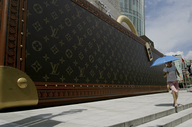 A huge model of a bag advertises a new Louis Vuitton (LVMH) store in Shanghai.