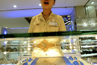 A sales girl greets the customer in a Shanghai store.