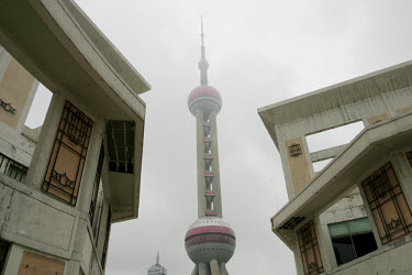 Pearl Tower seen through old buildings.