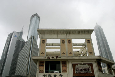 Contrast between old and new buildings in the Pudong district. The Jin Mao tower is on the right.