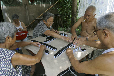Old people playing dominoes.
