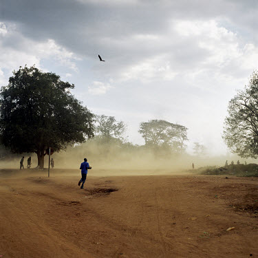 The wind whips up a dust storm in Kitgum.