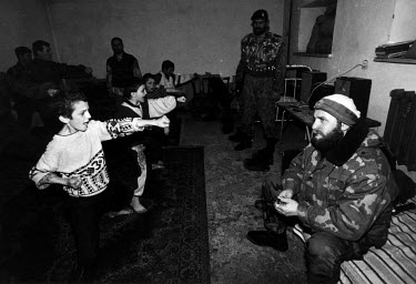 Ruslan Gelayev, a Chechen military commander, oversees the martial arts training of local boys.