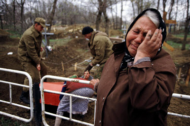 A Russian resident of Grozny crying at the burial of a relative killed in the assault on the city.