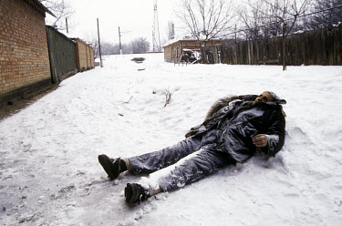 An elderly Russian resident of Grozny lies dead and frozen on the cities streets. Many Russian residents of the city had no relatives in rural Chechnya where they could take refuge during the bombing.