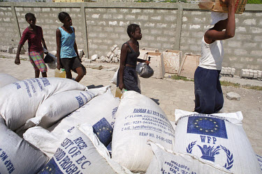 Food and relief supplies donated by the United Nations World Food Programme (UN WFP) being handed out in the wake of the flood. Three weeks after tropical storm Jeanne hit Gonaives parts of the city a...