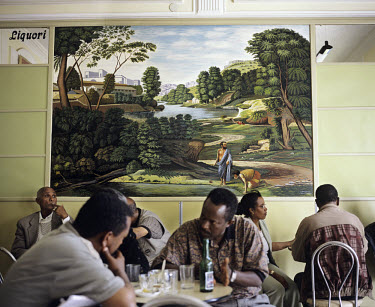 Painting in Bar Vittorio, a typical coffee house. Asmara is a showcase of 1930s Italian Art Deco architecture. Initially created by colonial-era Italians, the style continued to flourish in the 1960s...