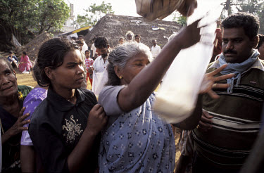 Food aid being distributed to victims of the tsunami which struck South Asia on 26/12/2004. An underwater earthquake measuring 9 on the Richter scale triggered a series of tidal waves which caused dev...