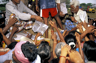 Distribution of grain to victims of the tsunami which struck South Asia on 26/12/2004. An underwater earthquake measuring 9 on the Richter scale triggered a series of tidal waves which caused devastat...