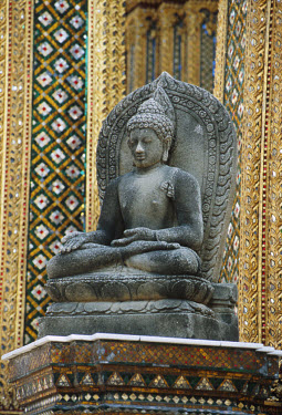 Statue of the Buddha in the Grand Palace. The Wat Phra Kaeo Temple in the Palace is the apogee of Thai religious art and the holiest Buddhist site in the country, housing the most important image, the...