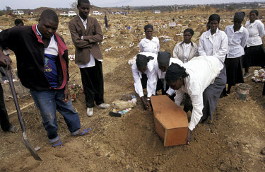 A girl, less than two years old, is buried after dying of an HIV related illness.