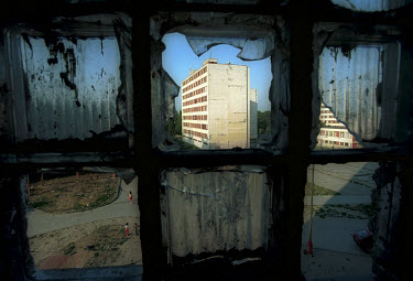 Broken windows frame apartment blocks in Lunik IX, a cluster of run-down buildings on the outskirts of Kosice, Slovakia�s second largest city. Once a racially mixed neighbourhood, Lunik IX has become...