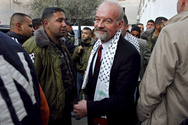 Peter Hansen, head of UNRWA, leaves a ceremony celebrating the reconstruction of demolished houses in the Jenin refugee camp. UNRWA is responsible for the welfare of Palestinian refugees throughout th...