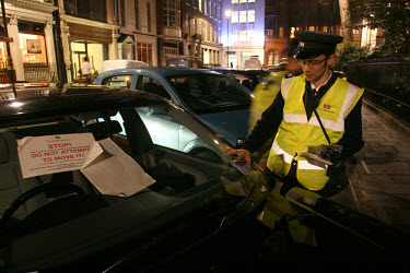 Traffic wardens work the night shift in London's West End.