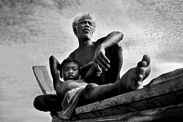Moken father and son. The Moken are a nomadic tribe of sea gypsies, numbering some two hundred, who live on Mu Ko Surin island off the western coast of Thailand. Scientific studies have shown that the...