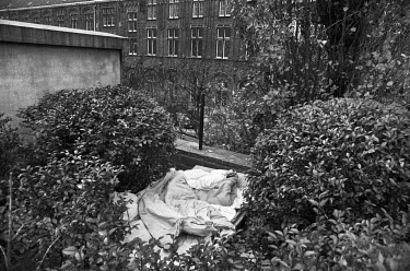 The sleeping place of a homeless illegal immigrant in a small park in the city centre.
