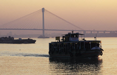 The new Howrah bridge across the Hooghly river, with a Calcutta-Howrah ferry in the foreground.