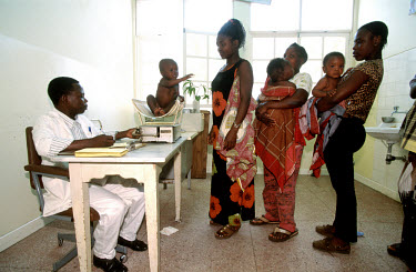Young mothers bring their infants for vaccinations at an integrated primary health care clinic.